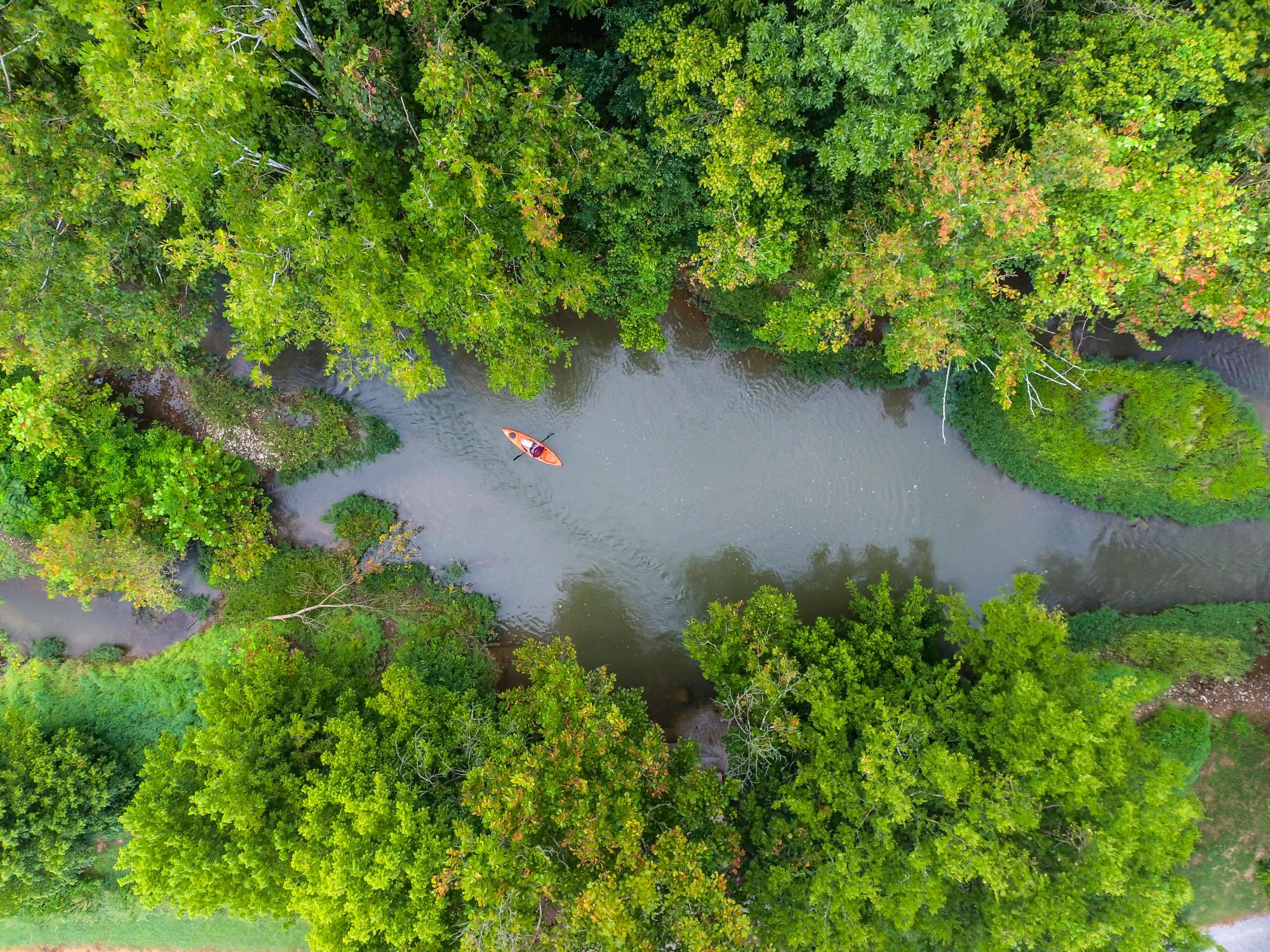 Drone shot of kayak in creek